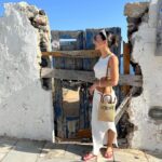 Natalie Negrotti Instagram - First time in Oia Santorini and I’m blown away by it’s beauty. My feet got so swollen I had to wear my pink shower chanclas to sight see before I bought matching Greek made sandals with my prima since my sneakers didn’t fit me! 😂 we rented a convertible red Fiat 🚗 and drove around exploring Santorini, Greece Oia, Santorini