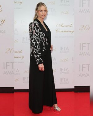 Niamh Algar Instagram - Thank you @IFTA for a spectacular night. So special to be there with my mum to celebrate the incredible achievements of Irish film & tv and to witness legend Joan Bergin receive her award for her outstanding contribution to this wonderful industry☘️ Special mention to Áine Moriarty & her team on making us all feel so welcome & @deirdreokane123 on being such a brilliant host as always! Congratulations to all the nominees and winners, and the absolute gent Ciarán Hinds whom I got to present the award for Best Supporting Actor-Drama to, so proud to be Irish!🫶🏻🇮🇪🎞️🎬

Styling by @hollyevawhite 
Wearing @sabina.bilenko