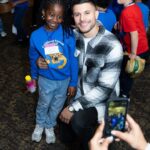 Nick Barrotta Instagram - spent my morning hanging with these awesome kids! 💙 thank you to the american giving project/ toys of hope team for having me back this year — and thank you for all you do for these children and families! today was a great reminder of what the holiday season is all about 🙏🏼💫 #toysofhope Oheka Castle