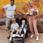 Nicki Shields Instagram - Two weeks of you Alyra! 💖 And the end of @marksainthill’s paternity leave😭… which may have turned into a two week long pub crawl of all our favourite spots🙌🏼… plus an essential trip to London Zoo thrown in. Our little lady has fitted in to family life very well and the novelty of stroking her head or holding her hand hasn’t worn off with the boys… yet! Tomorrow is a big day! Mark is back at work, so apparently that means I’m in charge…. 😳🤷🏼‍♀️. Ha…. Who am I kidding…. The kids are always in charge. They just let us pretend we are once in a while. Here goes! Big thank you to our friend and talented photographer @romybecker.photographer for capturing this moment 🥹 Thank you for the PR gifts for the kids and I from @thelittlegreensheep @bumppr @jandjoshlondon @bumpandmilk @fusecomms @boden_clothing @lauraparkesstyling_ 💚🤍 #AlyraLily #twoweeks #mumofthree #threeunderfive #angleseaarms #pubcrawl #paternity #baby #kidsclothing #family #photography #pregnancyfashion