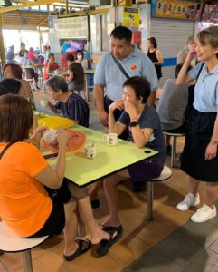 Nicole Seah Instagram - It always feels like home in Fengshan hawker centre, where @fooseckguan.sg, myself and the team had our market visits this morning. It’s my third time here in 2 weeks, as we visited in the evening after our weekday house visits and after food distribution. A volunteer remarked that it almost feels like a Kampong because the residents and stallholders we meet are always warm and welcoming, and ready to engage in a deep conversation about their lives and the issues that matter to them. One interesting convo that popped up by a lecturer having her breakfast, touched on how we can continue to foster interest amongst the youth to patronise hawker centres as a social gathering point, and to appreciate the hawker trade. It is hard work being a hawker, with many of the stalls opening at 4-5am just to prep and make sure they are ready for the day. We are also appreciative for the wealth of affordable culinary options available to us, even as hawkers grapple with the rising costs of raw materials. Fengshan Hawker Centre