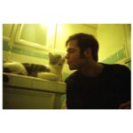 Noël Wells Instagram - just wanna get this out while I have my wits about me, but sadly today me and flinty had to put Mr. Feeny to sleep. To those who knew him, you know this is an end of a freaking era and I'm absolutely beside myself with sadness. 17 years. He was a cool fucking cat, who traversed many college adventures, apartments, houses, boyfriends, and eventually traveled 2000 miles to Los Angeles California where he settled underneath the Hollywood sign, calling Beachwood Canyon home. He was a soulmate and companion through many episodes of my youthful immaturity, but was very much loved and quite an honored and illustrious feline who would take walks around the neighborhood and played fetch. He made many brushes with death, but many more brushes with notoriety, landing himself in a viral zine (How to Talk To Your Cat About Gun Safety) being featured in a a published book (Cat Lady, curated by Leah Goren) and of course, he was the inspiration and basis for my first feature film "Mr. Roosevelt." We were lucky to be there with him in his final moments, and he was in my arms with his pretty white paws resting on my wrists like he used to when he was a lil one. Thank you so much Flint for being a good cat dad, and thank you Dave for everything. Thanks to all my friends who knew and got him. For just a fucking cat he was one of the very greats.