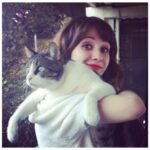 Noël Wells Instagram - just wanna get this out while I have my wits about me, but sadly today me and flinty had to put Mr. Feeny to sleep. To those who knew him, you know this is an end of a freaking era and I'm absolutely beside myself with sadness. 17 years. He was a cool fucking cat, who traversed many college adventures, apartments, houses, boyfriends, and eventually traveled 2000 miles to Los Angeles California where he settled underneath the Hollywood sign, calling Beachwood Canyon home. He was a soulmate and companion through many episodes of my youthful immaturity, but was very much loved and quite an honored and illustrious feline who would take walks around the neighborhood and played fetch. He made many brushes with death, but many more brushes with notoriety, landing himself in a viral zine (How to Talk To Your Cat About Gun Safety) being featured in a a published book (Cat Lady, curated by Leah Goren) and of course, he was the inspiration and basis for my first feature film "Mr. Roosevelt." We were lucky to be there with him in his final moments, and he was in my arms with his pretty white paws resting on my wrists like he used to when he was a lil one. Thank you so much Flint for being a good cat dad, and thank you Dave for everything. Thanks to all my friends who knew and got him. For just a fucking cat he was one of the very greats.