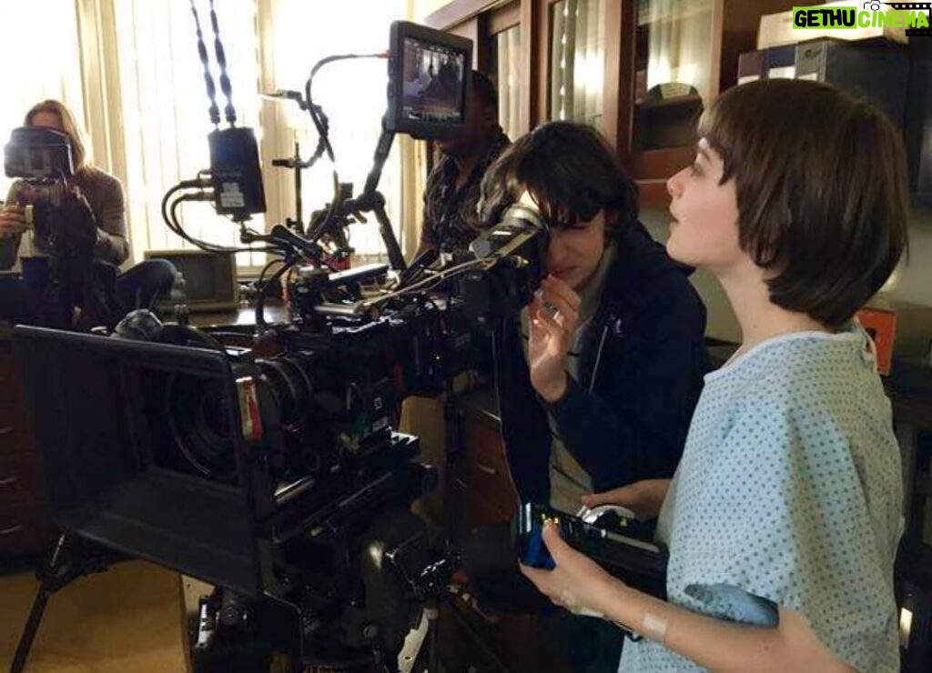 Noah Schnapp Instagram - Learning how to make television in a hospital gown and hair extensions