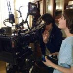 Noah Schnapp Instagram - Learning how to make television in a hospital gown and hair extensions