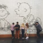 Noah Schnapp Instagram - Checking out the Lucy and Charlie Brown Wall mural @peanutsmovie Charles M. Schulz Museum