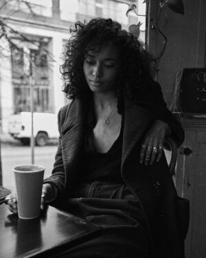 Olivia Swann Instagram - Friday on film ☕️ ⁣
⁣
Had a stroll through Downtown Vancouver with the glorious @noahasanias - a stunning photographer and utter dream of a human 🖤⁣
⁣
#downtown #vancouver #photoshoot #film #coffeemorning #pyrrha #blackandwhite #naturalhair #autumn #chillvibes