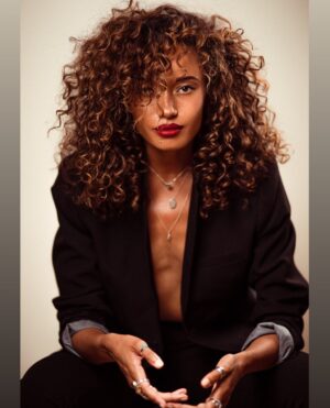 Olivia Swann Instagram - 📸📸

by @fay_not_faye 
mua @makeup.by.marilou 

#photoshoot #studio #vibes #suit #curls #monday #london #rings #redlips