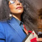 Parisa Fitz-Henley Instagram - Why choose one? Trent Crimm: The Independent Woman Jackie Collins. Happy Halloween, yall! 🎃😈🤓 Image Description: 1. Me with big gray-streaked frizzy hair, Trent Crimm glasses, Jackie Collins makeup, gray jacket and black button-down either of them could wear, silver dangling earrings, red lanyard that reads “Independent”, a notebook and pen. 2. Trent Crimm (of The Independen and Ted Lasso fame) in glasses, blazer, button down and tie. His face framed by luscious gray hair. 3. Jackie Collins, novelist extraordinaire, big frizzy delicious 80’s hair, loads of dramatic 80’s makeup, leopard print blazer/choker/earrings, staring down the camera like she’s about to pounce. 4. Me continuing to feel myself but this time with a bit of a pearl and diamond(ish) choker peeking out at my neckline)