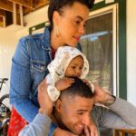 Parisa Fitz-Henley Instagram - Happy National Siblings Day @fitztheworldcitizen. You were born late so I get to post late. 🥰 Thanks for making me an auntie to this precious little bunny. [Image description: Me in a denim jacket, resting my head on my niece Anaya who’s wearing a cream colored hood with floppy bunny ears, resting her head on my brother Nasan’s head. Nasan is holding Anaya’s body steady and smiling, and I’m squeezing her cute feeeeet. We are all looking off camera.]