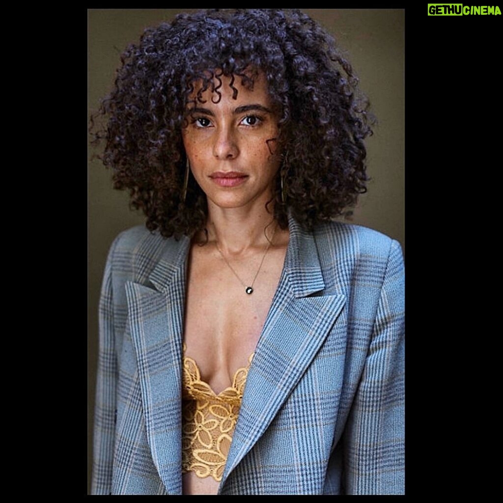 Parisa Fitz-Henley Instagram - Tbt to shooting with my long-time friend @raziwilsonphotography. She’s just moved back to LA so folks looking to shoot for work, play or healing (Razi uses therapeutic approaches for those looking to incorporate photography into their own healing work) check her out. Image description: A professional photo of me, from the waist up. I’m looking into camera. My hair is curly and I’m wearing a yellow lace top under a gray patterned blazer, with a small gold and pyrite necklace.