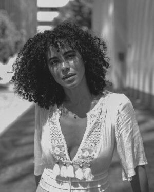 Parisa Fitz-Henley Instagram - More LA memories. Exploring shadow and light with @raziwilsonphotography 🤍🖤🩶

Post description: Three slides - black and white photos of me. A close up of me looking to camera, a medium shot of me walking, and a medium shot of me leaning back on a wall. In all I wear the same white dress and my hair is curly and shoulder length.

*Reposting correct edits