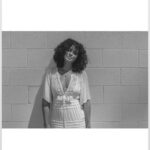 Parisa Fitz-Henley Instagram - More LA memories. Exploring shadow and light with @raziwilsonphotography 🤍🖤🩶 Post description: Three slides - black and white photos of me. A close up of me looking to camera, a medium shot of me walking, and a medium shot of me leaning back on a wall. In all I wear the same white dress and my hair is curly and shoulder length. *Reposting correct edits