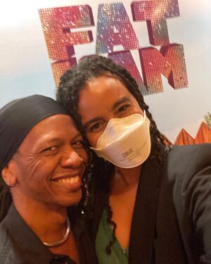 Parisa Fitz-Henley Instagram - #FatHam on Broadway with one of my besties. 🎭 🥰 This is the last week so if you’re in NY grab tix! Front and center of the mezzanine is fantastic! 

Slide 1: Me smiling, my hair in twists, wearing a white N95 respirator, gold earrings and a black blazer. I’m standing in front of the words “Fat Ham” in glitter on a wall. 

Slide 2: Me smiling, same place and time but with my friend Aeric (also smiling), who has brown skin and is wearing a silver necklace and thick black hair wrap/band. 

Slide 3: A selfie of me in my seat in the theater