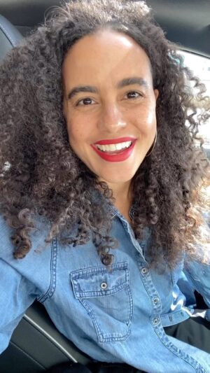 Parisa Fitz-Henley Instagram - Great news!!! @themonafoundation exceeded our #GivingTuesday goal by over 50%!! 18 young women will now be able to complete their education at the Barli Institute in Indore, India — improving the lives of an estimated 1,800 people along with them over time!! I’m so happy to see this and to know that so many people worked together to improve lives through so many organizations yesterday. Definitely something to remember when things get tough, that good things are happening too. I know I need that reminder daily. 🙏♥️🥹 Many many thanks to all who contributed financially or with good wishes and prayers for the success of this endeavor. Love to all! 

Video description: Close shot of me, brown skin, darker brown curly hair and dark brown eyes, red lipstick and medium gold hoop earrings. I’m wearing a blue denim button down shirt and sitting in my car. It’s daytime and cars are passing by on the road beside me.
