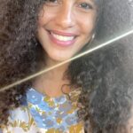 Parisa Fitz-Henley Instagram - Immigrant women, girls, and all survivors of violence deserve to live in safety and with dignity. On #GivingTuesday, I’m proud to support @tahirihjustice, a national nonprofit (US) that serves immigrants fleeing gender-based violence. The Tahirih Justice Center is named after Tahirih, a revolutionary 19th-century Persian woman of the Baháʼí Faith who was executed in Persia (now known as Iran) for unveiling and speaking out about her religious/spiritual beliefs. This took place more than two centuries ago, and yet, courageous women like Tahirih are still fighting for the most basic human rights here in the United States and all around the world. By amplifying the experiences of survivors in communities, courts, and Congress, Tahirih’s mission is to create a world in which all people share equal rights and live in safety and with dignity. I hope you’ll consider supporting @tahirihjustice this #GivingTuesday with a donation of any amount. Together, we can create a world that uplifts women, girls, immigrants, and all survivors of violence. Video Description: Me, brown skin with darker brown eyes and curly brown hair, shot from the chest up. I’m wearing a floral top that’s white, pale pink, light and darker blue. I have on gold hoop earrings and a gold chain. A beam of sunlight crosses the frame diagonally.