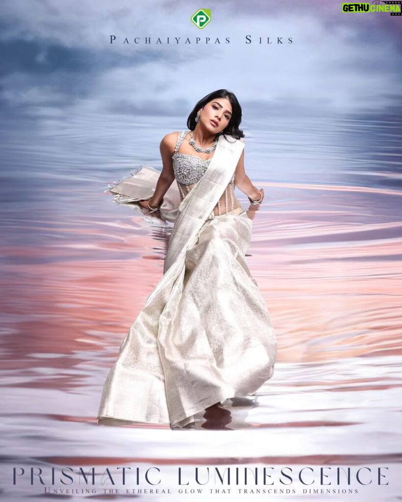 Pavithra Lakshmi Instagram - In the heart of a distant galaxy, where stars weave tales of timeless elegance, Pachaiyappas World introduces the Prismatic Luminescence Christmas Edition. Amidst celestial realms, three regal queens—Aryastra, Celestara, and Eclipsara—embrace the cosmic festivities, each personifying a unique facet of the collection. Aryastra graces the cosmic stage in 'Festive Frost Crystal,' embodying the serene beauty of winter nights. Her saree, woven with threads of starlight, captures the iridescence of snow-kissed crystals, echoing the silent magic of Christmas. . Model : @pavithralakshmioffl Creative concept design & Styling: @gowtham.618 Jewel: @aaranyarentaljewellery @idayaluxeee . #PachaiyappasMagic #pachaiyappas #pachaiyappassilks #silk #silksofindia #traditionalwear #festive #fantasy #christmas #collection #concept #shooting #creativephotography #creative #art #instagood #festivecollection #divine #textile #clothing #designer #fashion #stylewithpachaiyappas #saree #creativefashion #designerwear #sareelove #silver #trending