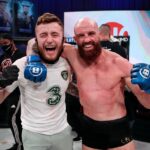 Peter Queally Instagram – What a lad this kid is, he got wind I was heading over to this fight on my own with no coach or corner team and immediately jumped on a plane and flew right across the country from California to be there for me. 
I absolutely love when he’s in my corner too, he’s such a little maniac it feels like we are walking out for a street fight when we are leaving my dressing room!
Walking back to him end of round 2 drenched in blood and him screaming in my face hahahaha, I would have took out The Hulk in round 3 if I had to!
Would go to war with him any day of the week! 💜
@strabanimalmma