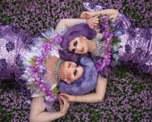 Pixie Polite Instagram - In the fairy garden 🧚‍♂️ 🌸 
•
Had an amazing time this week making over my fairy Drag Mother Wendy, AKA Trixie Truelove. Was amazing to live my pixie fantasy with her, paying tribute to my lovely Gran and Nana who are both no longer with us. They are my heroes 💜 
•
Loved shooting this with my gorgeous drag sister @woeaddams 💕 Dragg’ms family values! Please follow her! ✔️ 
•
💇‍♀️ @wigsbyriley 
👗 @stitchesbyjay_ 
💍 @draggedoutlondon 
💄 @boudica_the_queen 
📷 🎨 @michelangelo.mp3 
•
•
#drag #dragqueen #pixiepolite #dragqueens #draguk #dragqueensofinstagram #purple #flowers #pixies #tinkerbell #fairy #pixiehollow #picoftheday #photooftheday #gay #gayuk #dragrace #dragraceuk #rpdr #rpdruk #rupaulsdragrace #friendship #family #rupaulsdragraceuk #winxclub #wig #lacefrontal #makeup #curvygirl #makeover