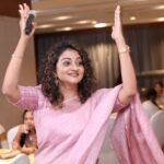 Priyanka Nair Instagram - Two hands high, one mic in tow—capturing the magic of a moment in the midst of the crowd's symphony. 🤲🎤😁