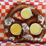 Rachel Nichols Instagram - Travel days are always cheat days. This pretzel is as big as my head…