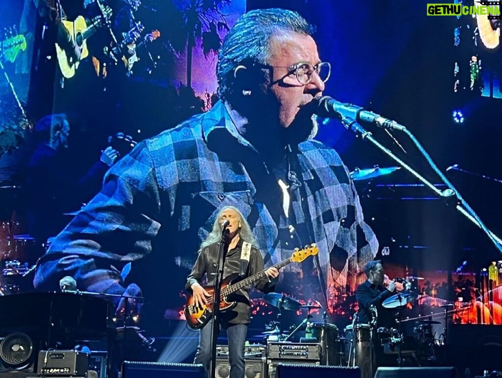 Rob Liefeld Instagram - Joy and I caught the Eagles last night for their final L.A. show at the Forum. Saw this GIANT in the front row and knew he was familiar…so great running into Marc & Bridgette Silvestri there. I’ve seen the Eagles at least ten times since they reunited in 1994, almost all with Joy, my favorite band. The music I was raised on. They are still as tight as they’ve ever been. Don Henley still has that golden voice, even at 72. Joe Walsh still shreds on his guitar. Timothy has that great range. Vince Gill feels like he’s been in the band forever and we saw Deacon Frey debut at Dodgers Stadium in 2017 and at times he looks and sounds just like his Pops. If you can catch em, you won’t regret it! #eagles