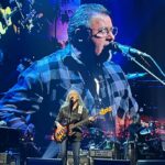 Rob Liefeld Instagram - Joy and I caught the Eagles last night for their final L.A. show at the Forum. Saw this GIANT in the front row and knew he was familiar…so great running into Marc & Bridgette Silvestri there. I’ve seen the Eagles at least ten times since they reunited in 1994, almost all with Joy, my favorite band. The music I was raised on. They are still as tight as they’ve ever been. Don Henley still has that golden voice, even at 72. Joe Walsh still shreds on his guitar. Timothy has that great range. Vince Gill feels like he’s been in the band forever and we saw Deacon Frey debut at Dodgers Stadium in 2017 and at times he looks and sounds just like his Pops. If you can catch em, you won’t regret it! #eagles