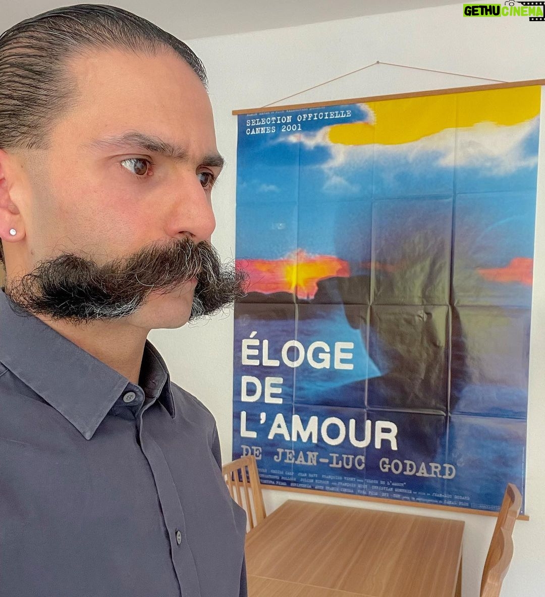Rouzbeh Rashidi Instagram - So delighted and empowered by the presence of my new wall hanging in my home, the original poster of Jean-Luc Godard's Éloge de l'amour from the 2001 Cannes Film Festival. Living, thinking and making cinema with #Godard every day! Onwards!