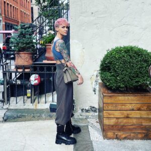 Ruby Rose Instagram - Peekaboo NYC. 🥰😍 I love the fall. X Thank you @fendi @silviaventurinifendi @mrkimjones #fendipeekaboo #ad

Image description 

Slide one:
I am standing in a NY street, next to a potted plant and a stairway. I’m wearing a new bag and my hair is pink and my heart is full.

Slide two: 
Someone ( a friend of mines son ) asked me to wear this dress, I’ve never worn a wrap dress and put it on back the front originally.. I corrected it for this photo. I have sunglasses on, but am inside, don’t judge me. 

Slide three: I am sitting in a taxi cab, petting my new bag because I’m a little awkward.