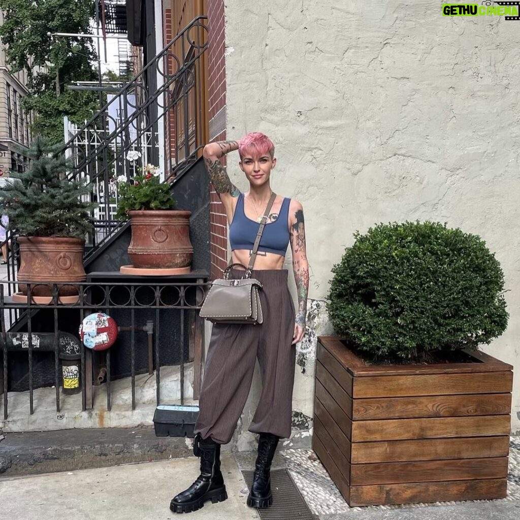 Ruby Rose Instagram - Peekaboo NYC. 🥰😍 I love the fall. X Thank you @fendi @silviaventurinifendi @mrkimjones #fendipeekaboo #ad Image description Slide one: I am standing in a NY street, next to a potted plant and a stairway. I’m wearing a new bag and my hair is pink and my heart is full. Slide two: Someone ( a friend of mines son ) asked me to wear this dress, I’ve never worn a wrap dress and put it on back the front originally.. I corrected it for this photo. I have sunglasses on, but am inside, don’t judge me. Slide three: I am sitting in a taxi cab, petting my new bag because I’m a little awkward.