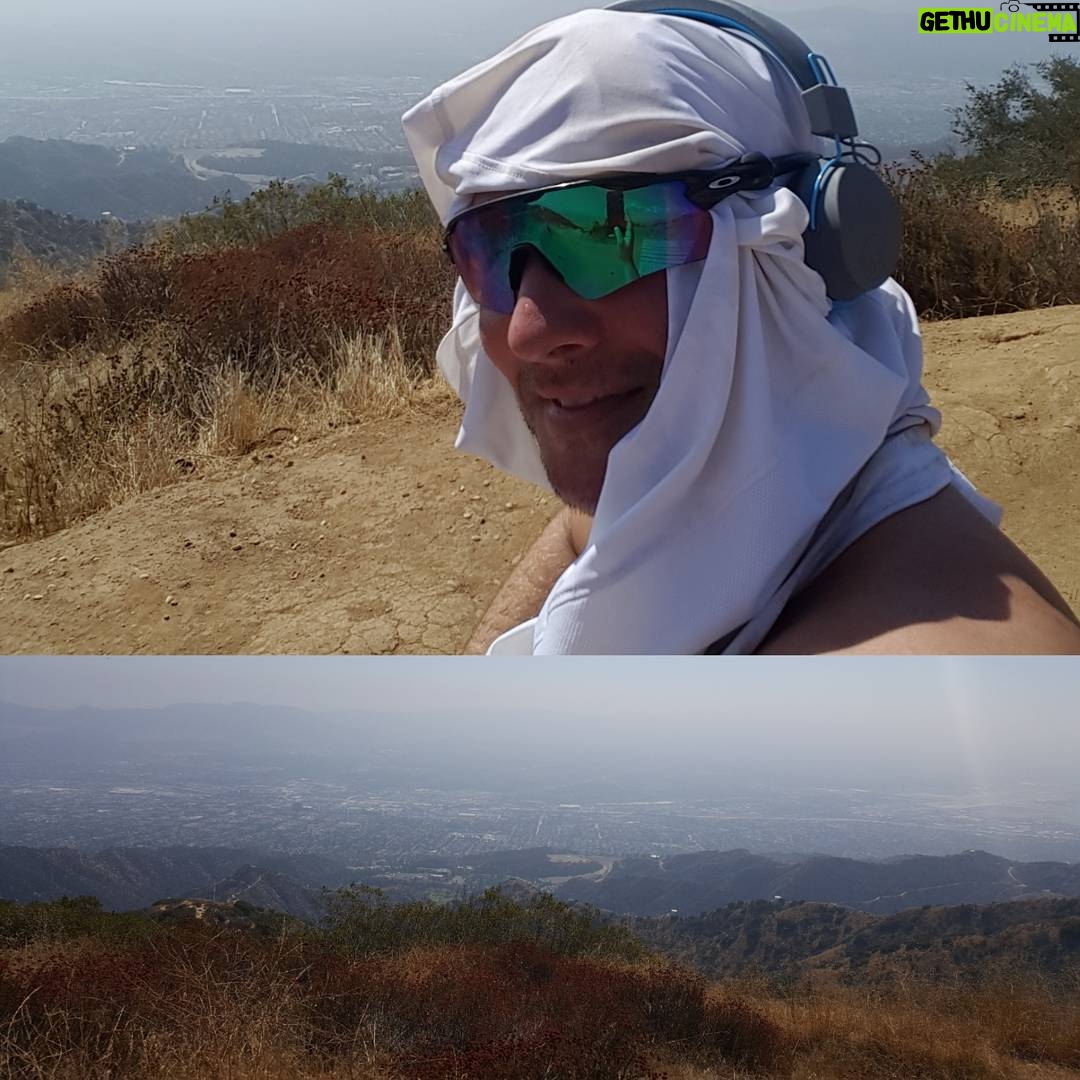 Ryan Merriman Instagram - This hike is like life. It can be hard at times, but if you push through.....the end result/view is worth it. #neverquit #peaceful #sweat #hardworkpaysoff #godisgood Yes that's my shirt on my head 😁