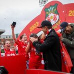 Ryan Reynolds Instagram - Two unbelievable days of Wrexham football. Nearly 20,000 people passed through the gates of the Racecourse Ground. @wrexham_afc won — but the main event was @wrexhamafcwomen winning it all and hoisting the big shiny trophy. These women played their guts out and @robmcelhenney and I couldn’t be prouder or more choked up.