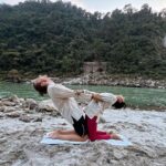 Sakshi Pradhan Instagram - #Balancing amidst the #sacred #energy of the Ganga, I find solace in the #fluid #dance of yoga poses. Each stretch and breath becomes a mindful communion with the river's #timeless flow, #grounding me in the present #moment . In this sacred space, the union of body and spirit #echoes the harmony of nature, a poignant reminder to be fully present in the #embrace of tranquility. 🧘‍♀️🧘🌊 #YogaByTheGanga #MindfulnessJourney #FlowingInHarmony #yoga #goat #tranquility #Peace Uttarakhand