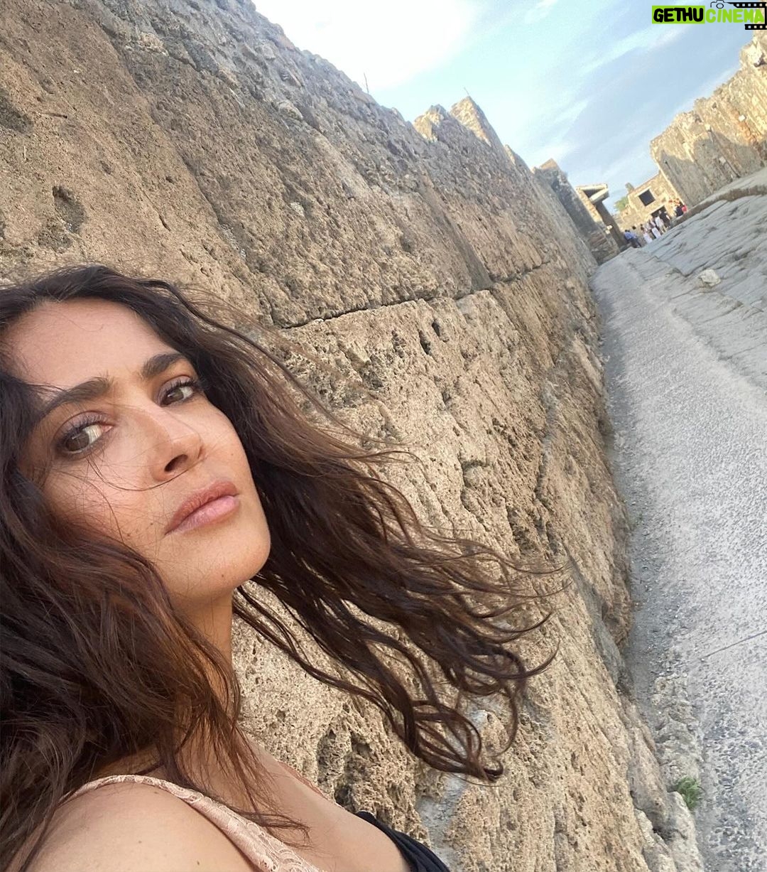 Salma Hayek Pinault Instagram - I feel an undeniable connection to the world that existed centuries ago. 🏛️🏺When you walk through the ruins of Pompeii you can’t help but imagine the lives of the people and their spirit linger in the air. The endurance of its buildings have survived to tell stories of of triumph and tragedy, of love and loss, all frozen in time. Thank you @massimo_osanna for this extraordinary experience. #italy #pompeii Pompeii, Italy