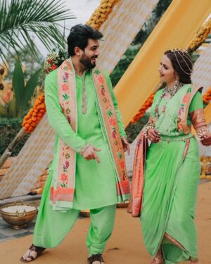 Shrenu Parikh Instagram - The start of a new chapter , sealed with Haldi 💛 💚 
 
Love, laughter and family 🥰 #LoveAtFirstTake 
.

Outfits of me and Akshay specially curated with love by @reenachopra 
Styled by @reenachopra 
Jewellery @sonisapphire 
Jewellery Styled by @nehaadhvikmahajan 
Bangles by : @rajputi_chuda_store 
Photography by @oragraphy 

Decor @the.creative.window 
.
Make -up by @the_beautytown 
.
Hair by @shinejanarthanan @mmtimemachine 
Event managed by @thetuliptouch 
Catering by @barodacaterers