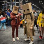 Simon Kippen Instagram - Interesting Comiconversation to say the least… @newyorkcomiccon @allelitewrestling @little__nightmares #Superbad #NYCC . . . . #cosplay #comiccon #aew #costume #littlenightmares