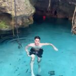 Siva Kaneswaran Instagram - This was incredible. It’s called a “Cenote”. (A large sinkhole or cave that exposes ground water ). There are many in Mexico. Our friend @pablocesart brought us to a secluded one so that we could spend more time exploring and meditate 🤯 Trees can’t grow high above Cenotes because the roots can’t grow deep but they find a way to work together and form root pillars in caves. It had so many cute residents in there. One of my favorite parts was the absolute silence…we meditated for 40 minutes in complete darkness. I could hear my heartbeat lol It was a Paraiso! #siva #thewanted #boyband #mexico #cenote #holiday #travel #vacation #nature