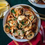 Stefano Faita Instagram - Prêts pour notre menu de la veille de Noël 100% poisson? Lien dans la bio pour tout savoir! 🐟 - Ready for our Feast of the Seven Fishes? The Italian traditional Christmas Eve dinner, from our family to yours. Link in bio to see the full menu. #feastofthesevenfishes #italianfood #italiantraditions #buonnatale #fishmeal #pescatarian #stefanofaita
