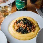 Stefano Faita Instagram - Here’s a new, easy, and hearty meal for your repertoire 👉 Polenta with kale & chickpea ragù 🤌 Give it a try! Nouvelle recette à ajouter à votre répertoire: Ragù de kale et pois chiches sur polenta. Allez, on l’essaie! 👇 Lien dans la bio 🔗 Link in bio #stefanofaita #cuisineitalienne #chickpeas #healthyfood #vegetarian