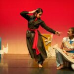 Suhani Dhanki Instagram - Magical Honey by @sanskruti_dance_cambridge Inspired by Matilda, this is the story of Maya who learns from Goddess Saraswati and teaches Headmaster Tusra a lesson! Photos by @simonphoto . . . I never imagined I'd love playing a mean character so much! But this show made for children and families brings me sooo much joy! Especially when little kids give feedback like, 'I liked when the Angry woman danced', 'The Headmaster falling was the best part' and the cutest of all is when my little Miraya asked her daddy, 'Mumma upset?', or cried 'Mumma fall down! Mumma wake up!!', or when she comes home and shows big eyes to her Grandma! This show has so much to offer - live music, storytelling with dance, audience interaction and the best of all, MAGIC!! After our premiere @cambridgejunction we will be performing at @nordenfarm in Maidenhead on 31 May. Lots more shows coming up in and around London! Stay tuned! . . . Credits: Concept and direction - Krishna Zivraj Performers - Linnea @cats_for_lenny Sia, Freya and myself Costumes - Zoe @zs.scrubs Set - Imogen @plimpsole_girl Magic consultant - @neilkelso Dramaturg - Chris Fogg Script - Aisha