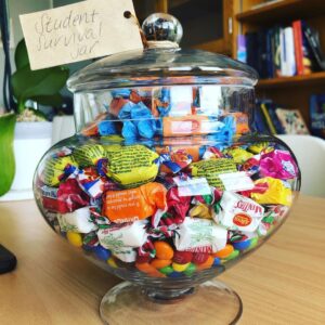 Susan Carland Instagram - Students: uni can be hard. I am here for you. (And colleagues, if you flip the tag, it says “staff survival jar” on the other side. I am here for you, too. Because academic life can also be hard). Lollies in the office are always a good idea!