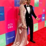 Susan Carland Instagram - Hello from LA! So great to attend the G’day USA gala hosted by the AAA last night, where Waleed was MC! It’s a night that celebrates the relationship between the arts industries in Aus and the US, and one of the highlights of the night was when they brought out piles of Tim Tams to every table. Now friends, I don’t want to alarm anyone but I noticed at the end of the night that someone (can only have been an American, as no Australian would ever) had taken one bite of the Tim Tam and LEFT THE REST ON THE TABLE. This can only be seen as an act of aggression and possibly war from what was once a great ally and I’m sure urgent talks are under way. ANYWAY. My dress is by none other than @aleemyusufcouture, make up was by @giigiisbeauty and in that last picture? You see me gazing absolutely adoringly at my husband. I know. Too much 🤷‍♀️ Los Angeles, California