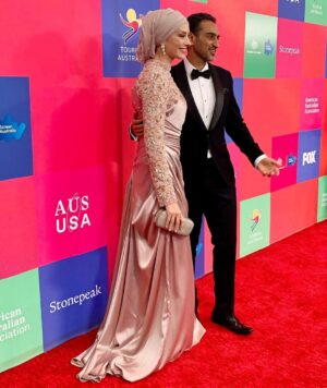 Susan Carland Instagram - Hello from LA! So great to attend the G’day USA gala hosted by the AAA last night, where Waleed was MC! It’s a night that celebrates the relationship between the arts industries in Aus and the US, and one of the highlights of the night was when they brought out piles of Tim Tams to every table. Now friends, I don’t want to alarm anyone but I noticed at the end of the night that someone (can only have been an American, as no Australian would ever) had taken one bite of the Tim Tam and LEFT THE REST ON THE TABLE. This can only be seen as an act of aggression and possibly war from what was once a great ally and I’m sure urgent talks are under way.
ANYWAY. My dress is by none other than @aleemyusufcouture, make up was by @giigiisbeauty and in that last picture? You see me gazing absolutely adoringly at my husband. I know. Too much 🤷‍♀️