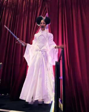 Tia Kofi Instagram - Drag Con UK Day One 👑
An incredible day I will always remember at @rupaulsdragcon! The new cast of Drag Race UK versus the World was officially announced. Swipe to see my reaction after the announcement 😇
Look by @mrmakonam 
Hair by @styledbyvodka 
Lightsaber by me rhinestoning for a week while watching Line of Duty on @bbciplayer 
#DragRace #DragRaceUK #ukvstheworld