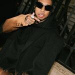 Tyga Instagram - When she got w u it was out of spite, I’m the black Superman u my kryptonite…married to the money throwin hunids like rice..