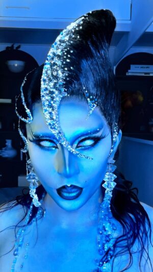 Vespi Instagram - Get ready with me for the Abyss 🧜‍♀️🪼

——

Masterpiece wig by @parizhair 🖤🩵💙
Lenses from @ttd_eye 

Pictures on my others post by @thefrenchbeautyboy 
And outfit by @gaia.imperial 

——

Using :
* @nyxcosmetics_france Freezie primer 
* @makeupforever ultra HD stick fondation in Y225
* @mehronmakeup cream blend stick in blue and white 
* @nyxcosmetics_france sfx matte in must Sea
* @makeupforever Star Lit powder 
* @nyxcosmetics_france lip lingerie in Naughty Noir 
* @ttd_eye blind white lenses 

——-

#dragrace #dragracefrance  #rupaulsdragrace #teamvespi #teamvespiche #vespi #drag #dragqueen #rpdr