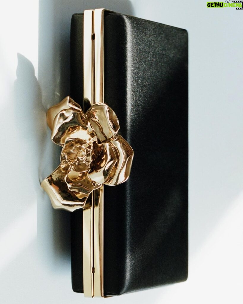 Victoria Beckham Instagram - The Frame Flower Minaudiere brings a jewel-like appearance, embellished with a statement flower clasp and fluid satin body. Available now at VictoriaBeckham.com and at 36 Dover Street. #VBHoliday
