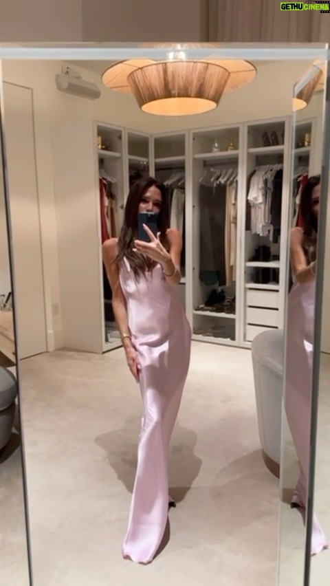 Victoria Beckham Instagram - I created this dress exclusively for @KimKardashian to wear at my #VBSS24 show in Paris. I immediately wanted it! The shape is simple, flattering and comes in a beautiful baby pink colour!! Sign up to be the first to access this limited-edition drop!! Kisses xx Sign up for this limited-edition dress and other exclusives at VictoriaBeckham.com and at 36 Dover Street (link in stories).