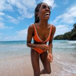 AJ Odudu Instagram – Hola! 💛 I’m lucky to have dodged a few wintery weeks, but to keep my skin hydrated when I return to the cold UK I’ll be covering myself in the new Delícia Drench Body Butter from @SoldeJaneiro 🌴💛

It locks in moisture for 24-hours and even nourishes our skin’s microbiome, giving that all-over sunshine glow whether we’re home or away. 😎🏡

It smells AMAZING and even has a brand new Cheirosa 59 Perfume Mist to match, giving the sweet scent of a holiday in a bottle. Love it! 💜 #ad