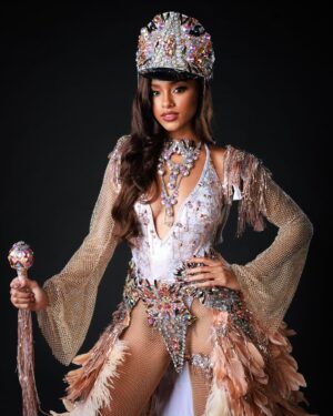Aché Abrahams Instagram - Ole Time Something Come Back Again! ⚓✨

Thank you to Lost Tribe and the amazing @solangegovia for this masterpiece that made our Miss World Trinidad and Tobago, Aché Abrahams an absolute standout at the Miss World International Pageant! 

#Herstory behind the costume by Solange Govia: 

When I think of modern mas pioneers like Jason Griffith and bands like the Belmont Battalion, their different details to the unique dances that were born out of the the traditional King Sailor, I feel it’s important to commemorate the Golden Era of Sailor Mas portrayals: acknowledging the sophistication, vibrancy and power of this mas character. 

I also started thinking about being a woman in the Carnival industry, and the fact that is also my duty to always honour our womanhood in these sacred traditions. I always want my costumes to remind people that there will always be a place and space for female representation in mas, and I am grateful that Val allowed me this amazing creative opportunity to challenge my design instincts, to inject this sense of femininity and grace into this design, and to just create freely.

From the embellished hat, to the towering collar, to the classic stick, I wanted to pay homage to the opulence that the Sailor Mas experience brings to the streets of Port of Spain. Of course, there had to be a design twist in this Fancy Sailor – the sand-coloured feathered skirt that replaced the bell-bottom pants, to not only represent the first visit of British, French and American naval ships in our nation’s history, but to also highlight where the Caribbean Sea meets the T&T shoreline. For me, it is this simple reminder that through every storm, women have become ‘the glue’ to the Carnival experience. We bring these powerful elements together to define our legacy, and we will always be pivotal in pushing the winds of change forward.”

Photography : @raj.vphotography 
Costume : @solangegovia @carnivaltribe 

#missworld #LAVWAY #missworldtrinidadandtobago 
#SolangeGovia #fancysailor #history #designer 
#carnivaltt